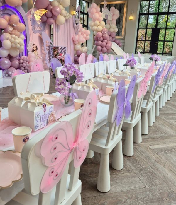 Lilac and pink birthday table with butterfly wings for kids