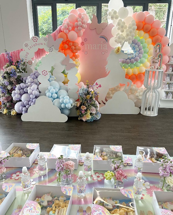 dreamy unicorn themed birthday decorations and table setup