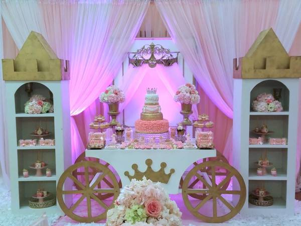 pink and gold princess party desserts on princess carriage