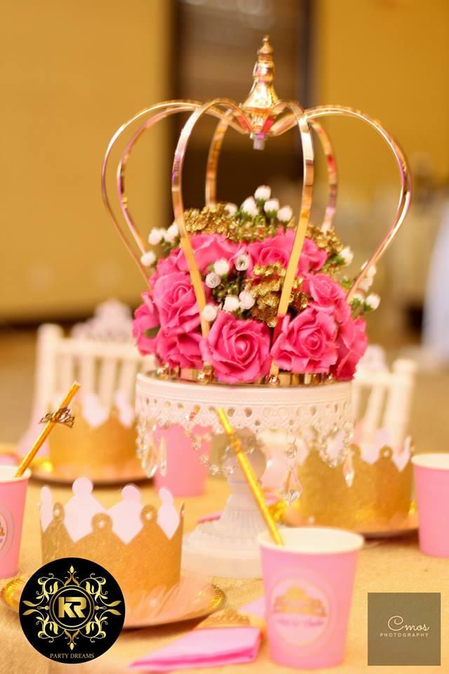 gold tiara and floral centerpieces