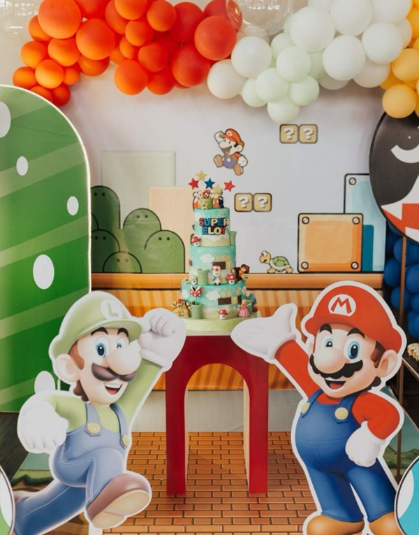 3 tier cake with mario game character props
