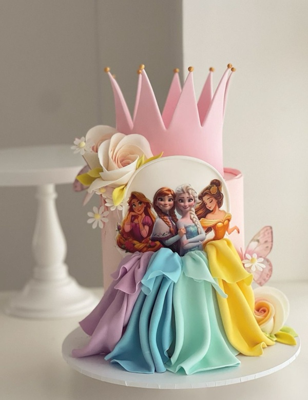 elegant disney princess cake with dresses flowing