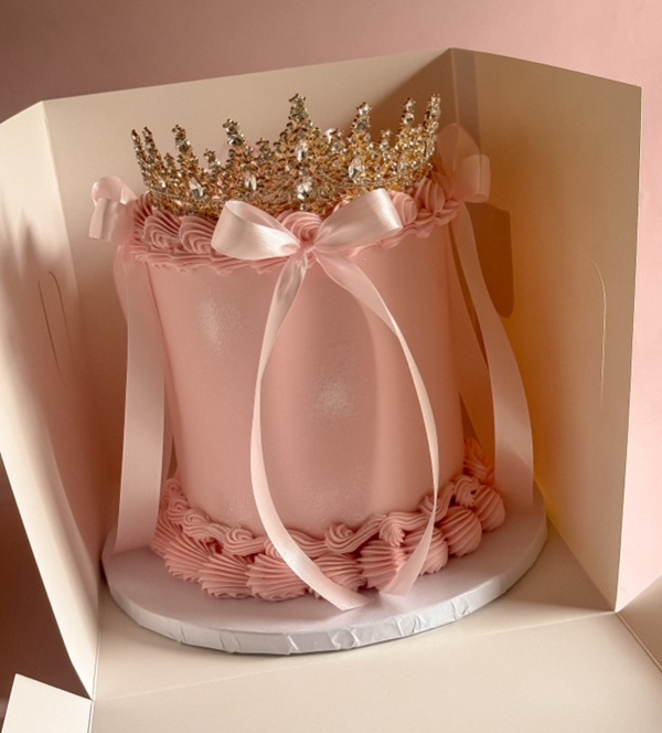 elegant princess cake with gold tiara topper