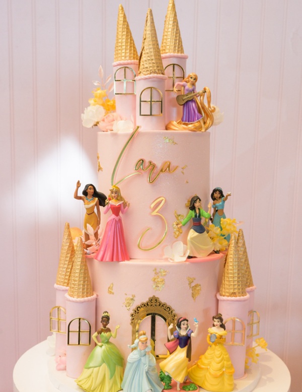 gold and pink two tier cake Disney Princesses decors