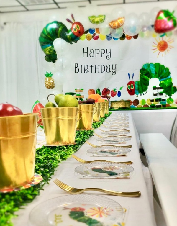 gold tins with fruits centerpiece